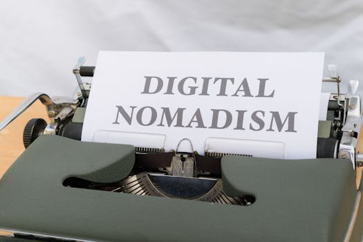 A vintage typewriter displaying the text 'Digital Nomadism,' symbolizing the modern remote work trend.