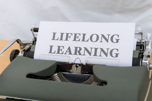 Close-up of a vintage typewriter displaying 'Lifelong Learning' on paper.